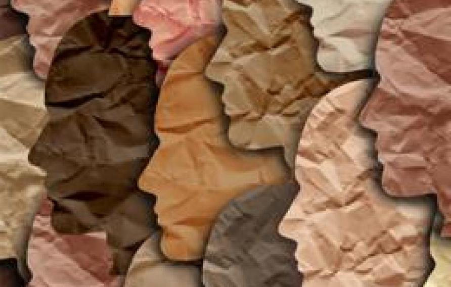 paper cutout of profiles of people in a diverse array of skin colors